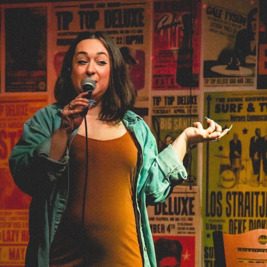 Kaira Williams telling comedy on stage