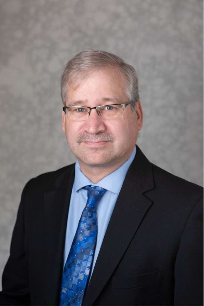 Headshot of Dr Paul Isely