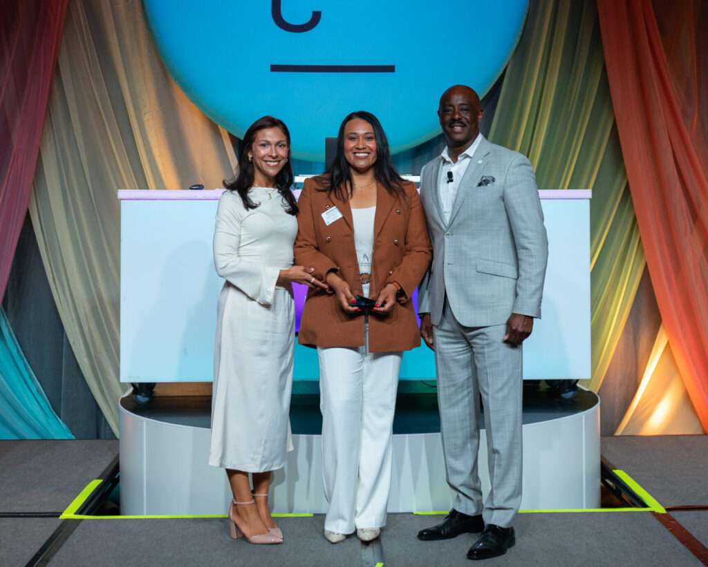 Sandyvel Polanco receiving the ATHENA Young Professional Leadership Award